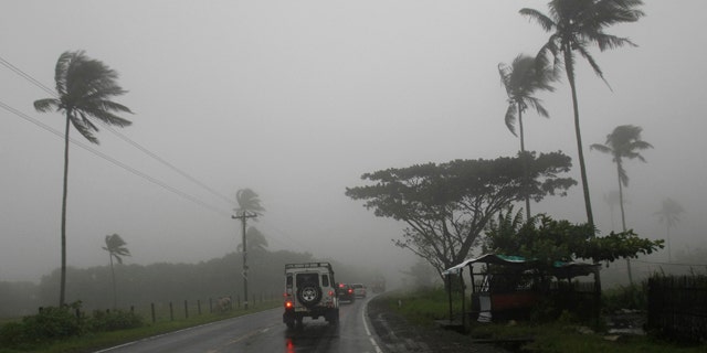 Aug. 27: Motorists drive on a highway in Batangas, south of Manila, Philippines, under a dense fog and rain brought about by typhoon Nanmadol.