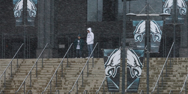 Dec. 26, 2010: Fans walk around Lincoln Financial Field, home of the Philadelphia Eagles football team, as snow falls in Philadelphia.
