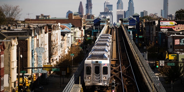 A train moves along the Market-Frankford Line in Philadelphia, Wednesday, Oct. 26, 2016.
