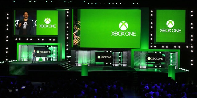 Phil Spencer, corporate vice president of Microsoft Studios, speaks during the Xbox E3 Media Briefing at USC's Galen Center in Los Angeles, California. He later released a statement apologizing for an offensive comment one employee made towards another during a 'Killer instinct' demonstration.