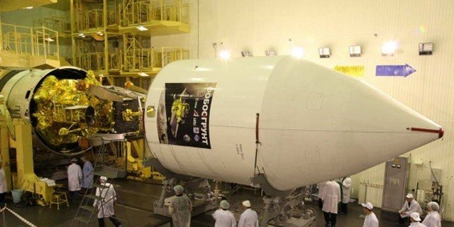 Phobos-Grunt and Yinghuo-1 spacecraft being encapsulated inside the nose cone for November 9 launch (Nov. 8 EST) to Mars and its tiny moon Phobos.