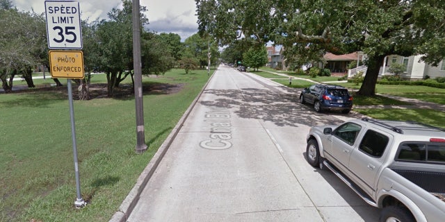 A sign warns approaching cars to the presence of the camera.