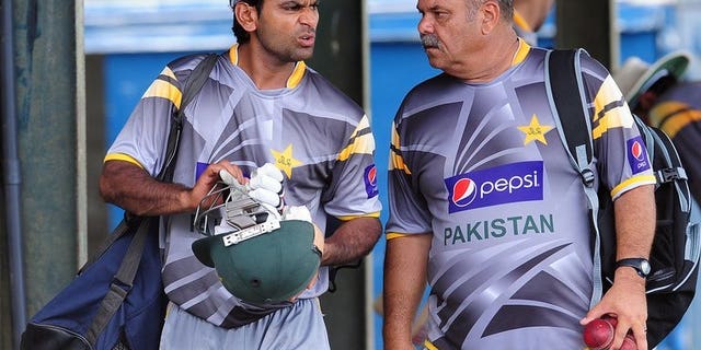 Pakistan coach Dav Whatmore (right) gives instructions to player Mohammad Hafeez during a practice session in Colombo on June 28, 2012. Whatmore said the team would be reviewed with an eye on building for the 2015 World Cup after their dismal showing at the Champions Trophy in England
