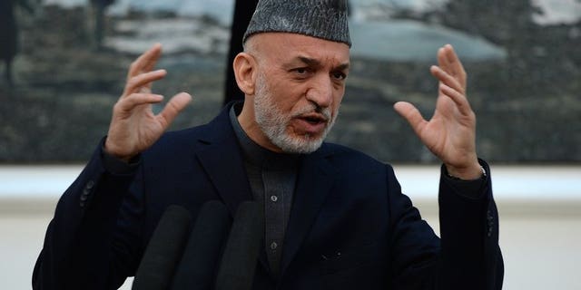Afghanistan President Hamid Karzai addresses media representatives in Kabul on May 4, 2013. Karzai said that Afghan government envoys are to travel to Qatar to try to open peace talks with the Taliban on a possible deal ending 12 years of conflict.