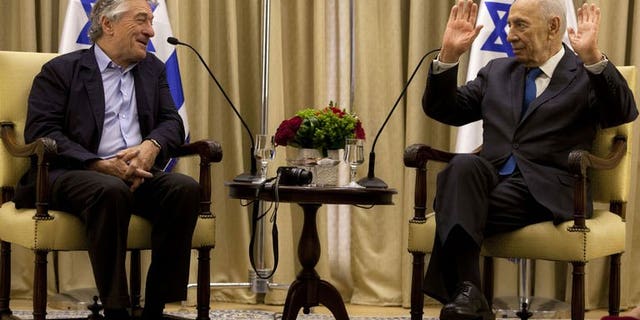Israel's President Shimon Peres meets with US actor Robert De Niro at the President's residence in Jerusalem, on June 18, 2013. A slew of stars, politicians and public figures were flocking to Jerusalem to take part in Peres's 90th birthday celebrations to be held later.