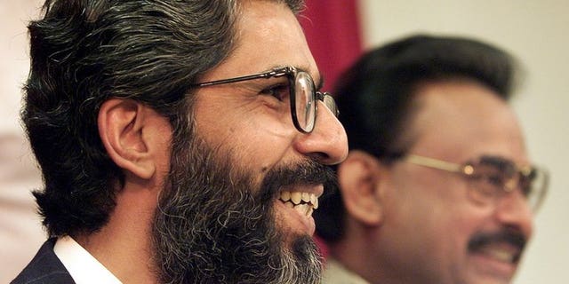 Pakistani Muttahida Quami Movement (MQM) secretary general Imran Farooq (left) gives a press conference in London on September 9, 1999. British counter-terror police on Tuesday searched two residential properties in London as part of an investigation into the murder of Pakistani politician Imran Farooq almost three years ago.