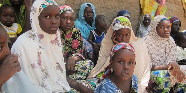 Nigerian refugee women and children in Gance in northern Cameroon on May 25. At least 9,000 people have fled violence in northern Nigeria and crossed into neighbouring countries as a government offensive aims to end a four-year Islamist insurgency, the UN said on Tuesday.