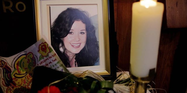 A candle burns next to portrait of Jill Meagher during a memorial mass at St.Peters Catholic church in Drogheda, Ireland, on October 5, 2012. A serial sex offender was on Wednesday sentenced to life for the "savage" rape and murder of Meagher (an Irish) in a Melbourne street, a random killing which shocked Australia and led to an outpouring of emotion.