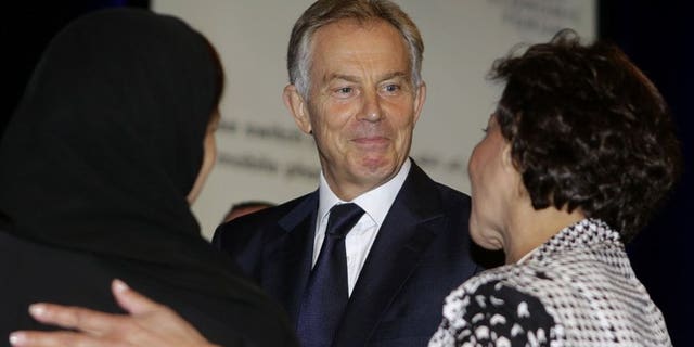 Tony Blair talks to other delegates at a conference in Jordan last month. Time is running out for the Middle East peace process, which must move forward or face total failure, the former British prime minister said on Wednesday.