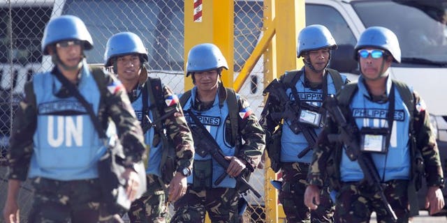 Philippines troops at the Quneitra crossing between Syria and the Israeli annexed Golan Heights last week. The Philippines Wednesday said it would keep its peacekeepers in the Golan Heights until at least August, and may stay longer if the United Nations increased security there.