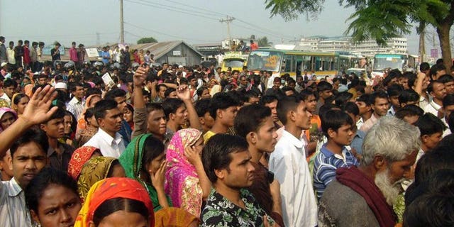 In a file picture taken on December 13, 2010 Bangladeshi garment workers block the road in Gazipur some 35 kms north of Dhaka. Owners of a Bangladesh garment factory were forced to offer prayers and distribute food to the poor on Wednesday in a bid to drive out what workers believed was a ghost at the plant, police said.