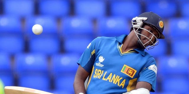 Sri Lanka's Angelo Mathews avoids a ball during the 2013 ICC Champions Trophy cricket match between Sri Lanka and New Zealand at The Cardiff Wales Stadium in Cardiff, Wales, on June 9, 2013. Mathews on Wednesday vowed that his "fighting team" were prepared to put recent history behind them when they face India in the semi-finals of the Champions Trophy.