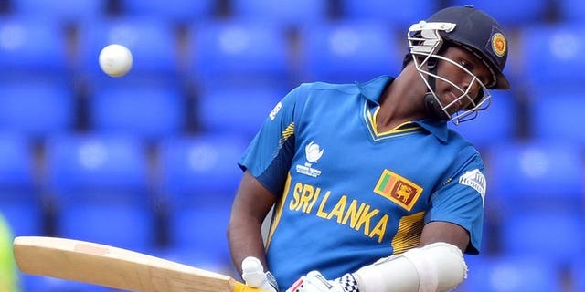 Sri Lanka's Angelo Mathews avoids a ball during the 2013 ICC Champions Trophy cricket match between Sri Lanka and New Zealand at The Cardiff Wales Stadium in Cardiff, Wales, on June 9, 2013. Mathews on Wednesday vowed that his "fighting team" were prepared to put recent history behind them when they face India in the semi-finals of the Champions Trophy.