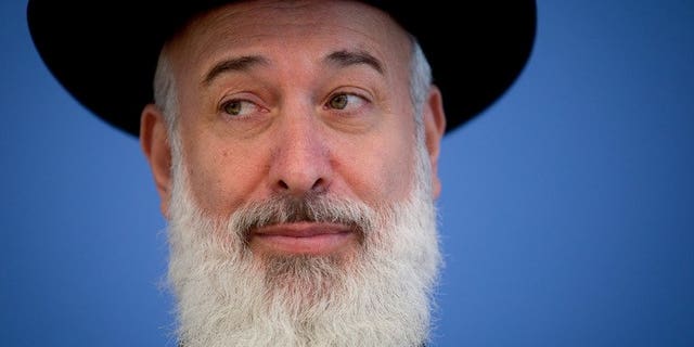 Israeli Chief Ashkenazi Rabbi Yona Metzger speaks, seen on August 21, 2012 in Berlin, Germany. Israel's chief Ashkenazi rabbi has been put under house arrest after a marathon grilling by detectives on suspicion of bribery, theft and breach of trust.