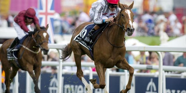 Jockey Richard Hughes rides Talent to victory in The Oaks at the Epsom Derby Festival in Surrey, southern England, on May 31, 2013. Three days of disappointment for Hughes dissolved in an instant when Sky Lantern carried the British champion jockey to a pulsating victory in the Coronation Stakes at Royal Ascot on Friday.