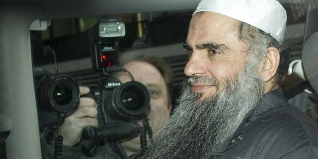 Radical Islamist cleric Abu Qatada sits in a car as he is driven away from a Special Immigration Appeals Hearing at the High Court in London on April 17, 2012. A treaty intended to clear the way to deporting radical cleric Abu Qatada to Jordan has passed into law in Britain.