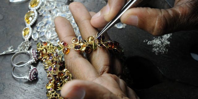 A Sri Lankan worker crafts gold jewellery in the southern city of Galle on January 20, 2011. Sri Lanka announced a 10 percent tax on gold imports Friday in what observers said was a bid to curb smuggling to India as global markets trading in the precious metal reported sharp price drops to 2010 levels.