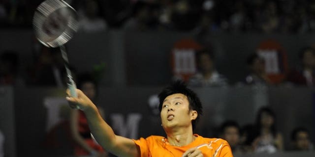 Thailand's Boonsak Ponsana hits a return against Japan's Ueda Takuma during their men's singles semi-final badminton match at the Singapore Open on June 22, 2013. Boonsak won 21-8, 21-15.