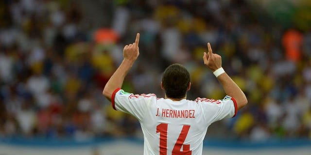 Mexico's forward Javier Hernandez celebrates after scoring against Japan during their FIFA Confederations Cup Group A football match, at the Mineirao Stadium in Belo Horizonte on June 22, 2013. Javier Hernandez scored twice but missed a last-minute penalty as Mexico defeated Japan 2-1 on Saturday to leave the Asian side winless at the Confederations Cup.