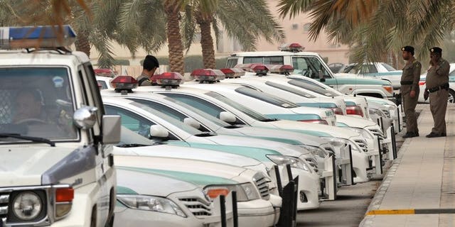 Saudi police cars are parked outside the Al-rajhi mosque in Riyadh, on March 11, 2011. Saudi police have killed a man who fled when they tried to arrest him for allegedly taking part in unrest that shook the kingdom's Shiite-populated Eastern Province last year, according to the official SPA news agency.