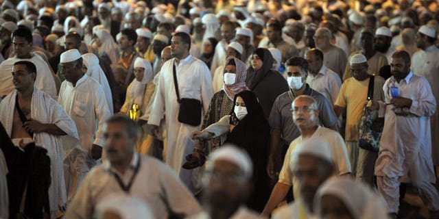 Tens of thousands of Muslim piligrims leave Mecca's Grand Mosque after the evening prayer on November 2, 2011. Twelve Sudanese were killed when a wall collapsed as they waited to submit their applications for the annual hajj pilgrimage, official TV said.