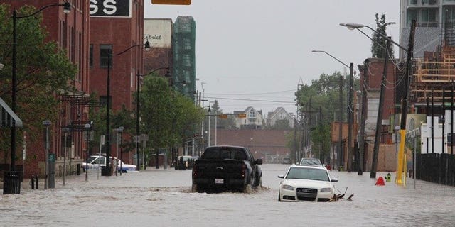 Downtown Calgary stands flooded with rising waters from torrential rain and swollen rivers in Alberta, Canada, on June 21, 2013. Canadian authorities in the western city of Medicine Hat ordered Sunday the evacuation of buildings in low-lying areas a day after flooding killed three people and forced 100,000 to leave Calgary.