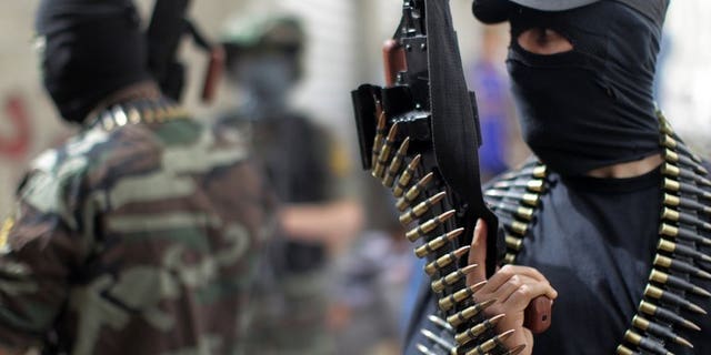 Palestinian militants from the Islamic Jihad group in Jabalia in the northern Gaza Strip on April 8, 2013. Islamic Jihad severed contacts with the Hamas rulers of Gaza Sunday after a commander in its military wing died of wounds sustained in a police shooting, a leader of the radical group told AFP.