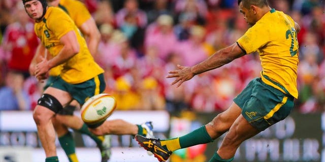 Australia's Kurtley Beale slips as he attempts a winning penalty against the British and Irish Lions on June 22, 2013. Lions coach Warren Gatland has taken a swipe at the battered Wallabies ahead of this week's potentially decisive Melbourne Test by hinting a lack of professionalism by Beale cost Australia victory in Brisbane.