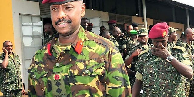 Brigadier Muhoozi Kainerugaba (L), son of Ugandan President Yoweri Museveni and commander of the Ugandan Special Forces Command, at the Sera Kasenyi training centre for Special Forces in Kampala on August 16, 2012. Kainerugaba has said he has no current plan to succeed his father, refuting weeks of opposition accusations he was preparing to take over power.
