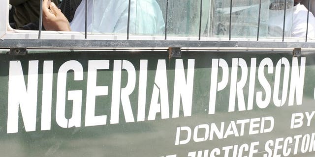 Prisoners sit on March 7, 2011 in a bus after a hearing in Lagos. Nigerian authorities on Monday hanged four prisoners, an official said, in what was believed to be the country's first known executions since 2006, drawing outrage from rights activists.