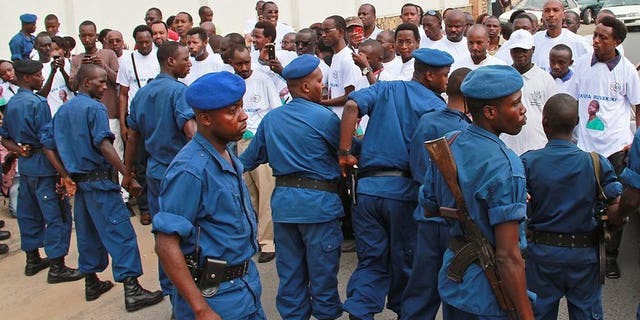 File picture shows police containing protesters in the Burundian capital Bujumbura appealing to end journalist Hassan Ruvakuki's jail sentence, February 19, 2013. A separate Burundian TV journalist arrested 10 days ago on suspicion of breaching state security has been provisionally released, the state prosecutor's office said Tuesday.