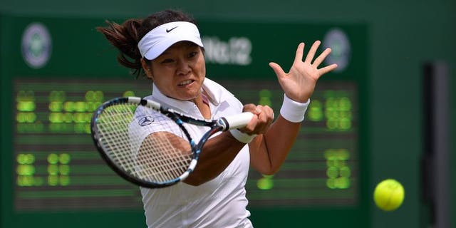 China's Li Na returns against Michaella Krajicek during their women's first round match on day two of the 2013 Wimbledon Championships tennis tournament at the All England Club in Wimbledon, southwest London, on June 25, 2013. Li won 6-1, 6-1.