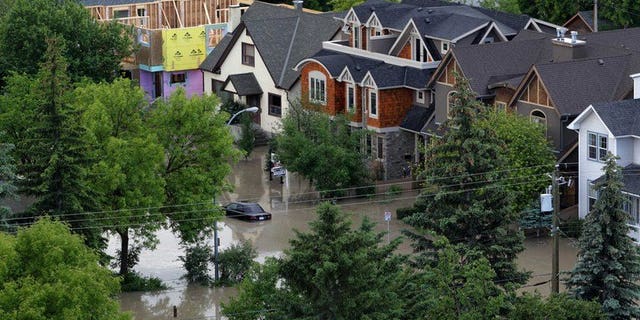 A neighbourhood beside the Bow River in Calgary, Alberta, Canada, is flooded on June 22, 2013. Canadian authorities upped the Alberta flood death toll to four Wednesday, after an autopsy revealed an 83-year-old woman had drowned in her ground-level apartment near the Elbow River.