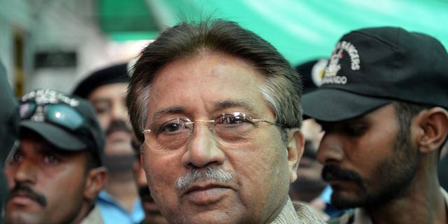 In this photograph taken on April 20, 2013, former Pakistani president Pervez Musharraf (C) is escorted by soldiers as he arrives at an anti-terrorism court in Islamabad. Pakistan on Thursday moved a step closer to putting Musharraf on trial for treason, by appointing a committee to investigate him for subverting the constitution.