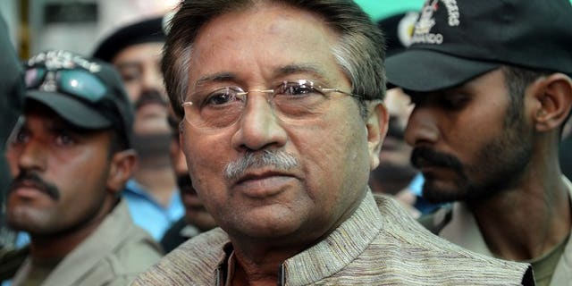 In this photograph taken on April 20, 2013, former Pakistani president Pervez Musharraf (C) is escorted by soldiers as he arrives at an anti-terrorism court in Islamabad. Pakistan on Thursday moved a step closer to putting Musharraf on trial for treason, by appointing a committee to investigate him for subverting the constitution.