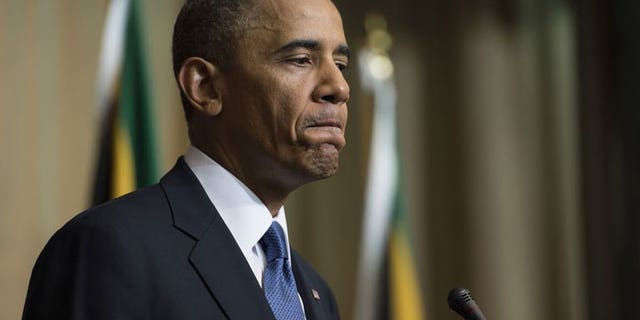 US President Barack Obama addresses a news conference in Pretoria, South Africa, June 29, 2013. Obama has said the "timing was not right" for him to travel to Kenya, his father's homeland, during his current Africa tour, but he expected to go there many times in the future.