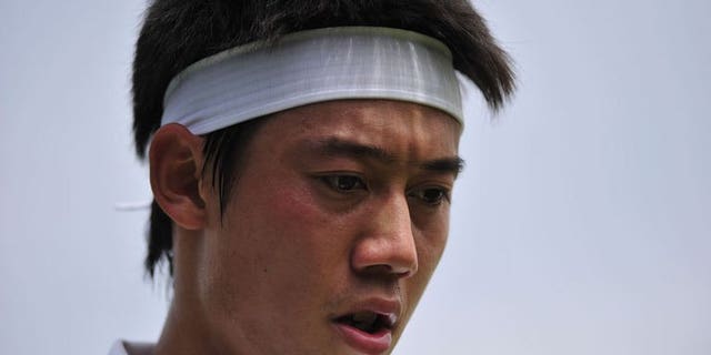 Japan's Kei Nishikori plays against Italy's Andreas Seppi in their third round match at Wimbledon on June 29, 2013. Nishikori has vowed to bounce back from his frustrating Wimbledon exit by turning on the style during the US hardcourt season.