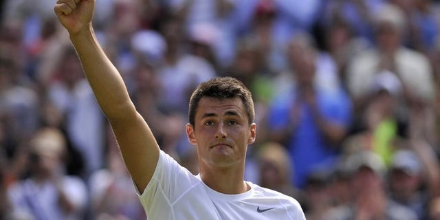 Australia's Bernard Tomic celebrates a match victory in Wimbledon, London, on June 29, 2013. Tomic is facing a fourth round clash with Czech seventh seed Tomas Berdych on Monday and thinks his dad's training can give the 2010 Wimbledon runner-up plenty to think about.