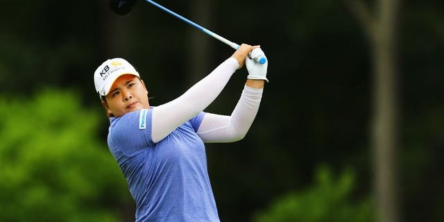 Park In-Bee of South Korea hits the ball on the fifth tee at Sebonack Golf Club on June 30, 2013 in Southampton, New York. World number one Park won the US Women's Open on Sunday, grabbing a slice of LPGA history with her third straight major triumph in 2013.