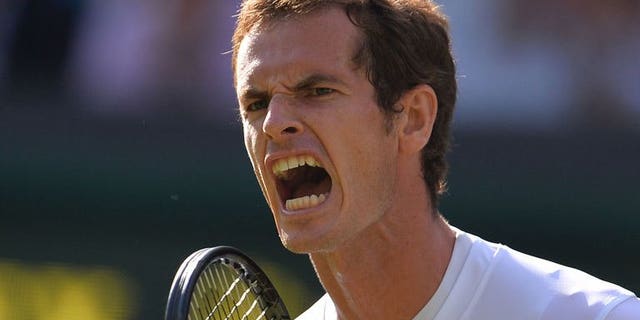 Britain's Andy Murray celebrates winning the second set against Russia's Mikhail Youzhny during their fourth round men's singles match on day seven of Wimbledon at the All England Club in London, on July 1, 2013. Murray won 6-4, 7-6 (7/5), 6-1.