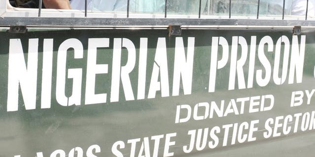 Prisoners sit on March 7, 2011 in a bus headed to prison from Lagos. Nigerian authorities have rearrested 49 of 175 prison inmates who escaped from their southwest city jailhouse after it was attacked by gunmen, a spokesman of the Nigerian Prisons Service said on Monday.