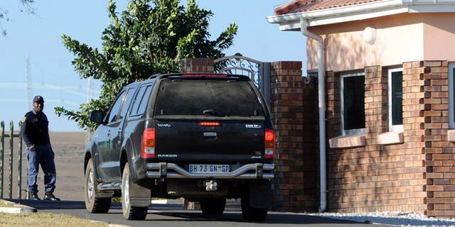 A car carrying elders from the Mandela family is seen outside the former state president's home in Qunu on June 25, 2013. Lawyers for Nelson Mandela's relatives met Monday to try to resolve a bitter family feud over the eventual burial site of the critically ill anti-apartheid hero.