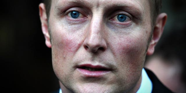 Former SAS sniper Danny Nightingale speaks to the media as he leaves the High Court in London on March 13, 2013. Nightingale will on Tuesday face the first day of evidence against him at a military court, where he is accused of illegally possessing a pistol and ammunition.