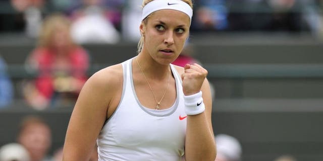 Germany's Sabine Lisicki celebrates taking a point against Estonia's Kaia Kanepi during their women's quarter-final match at the Wimbledon Championships in southwest London, on July 2, 2013. Lisicki swept into the Wimbledon semi-finals with an emphatic 6-3, 6-3 victory over Estonia's Kaia Kanepi.