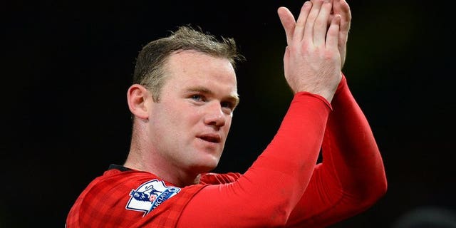 Manchester United's Wayne Rooney acknowledges the crowd after the final whistle in the league match against Everton at Old Trafford, on February 10, 2013. Rooney may wish to leave the Premier League champions in order to seek a "fresh challenge" elsewhere, according to former assistant coach Mike Phelan.
