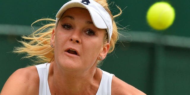 Poland's Agnieszka Radwanska eyes a return against China's Li Na during their quarter-final match at the Wimbledon Championships in southwest London, on July 2, 2013. Radwanska won 7-6 (7/5), 4-6, 6-2 in a two-hour, 43 minute contest on Centre Court.