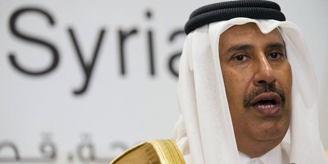 Qatari former prime minister and foreign minister Hamad bin Jassim al-Thani, speaks at a news conference on June 22, 2013. The former prime minister and strongman was Tuesday replaced as deputy head of the powerful Qatar Investment Authority in a shakeup ordered by the country's new young emir, official QNA news agency reported.