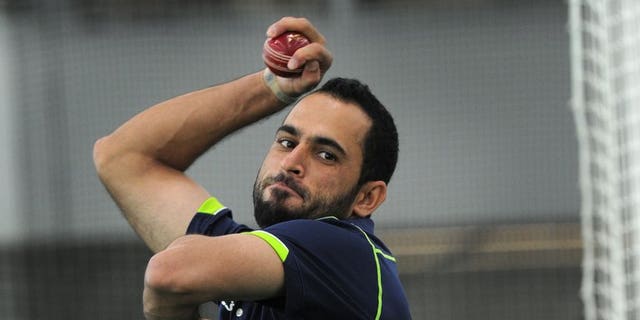 Legspinner Fawad Ahmed bowls at the indoor cricket nets at the MCG in Melbourne on June 6, 2013. England great Graham Gooch expressed surprise Tuesday that Australia were prepared to pick Ahmed