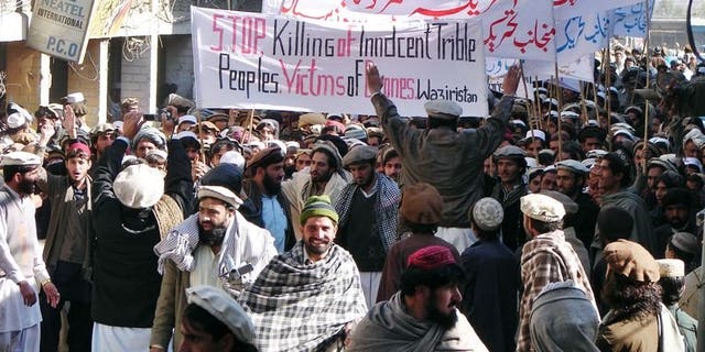 Pakistani tribesmen march during a protest rally against the US drone attacks, in Miranshah, the main town in North Waziristan district on January 21, 2011. A US drone strike early Wednesday killed four militants in the northwestern tribal area of Pakistan, local officials said.