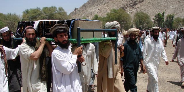 Pakistani tribesmen carry the coffin of a person allegedly killed in a U.S. drone attack, in Miranshah, in 2011. A U.S. drone attack struck a compound of the Al Qaeda-linked Haqqani network, killing at least 17 militants.